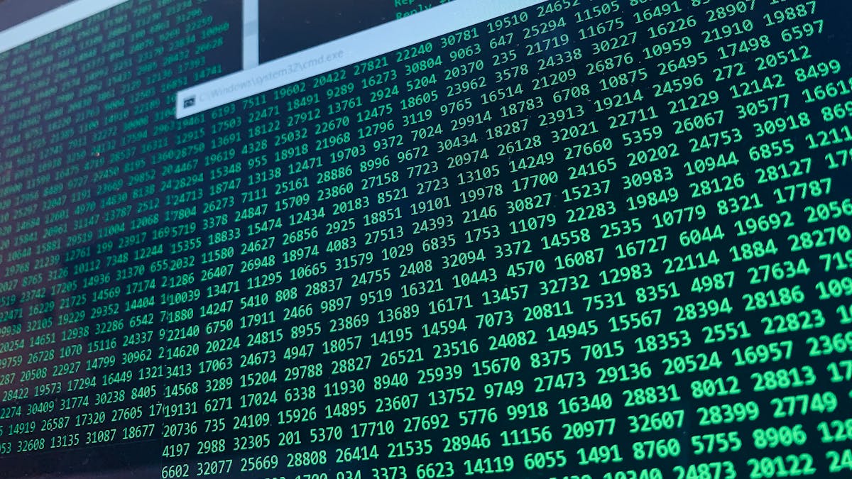A screen showing rows and columns of cyan and green numbers