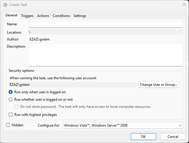 Windows Task Scheduler Create Task properties dialog showing the General tab with the Name, Location, Author, and Description fields at the top and the Security options section below containing the run-as account picker, run-only-when-logged-on / run-whether-logged-on radio buttons, do-not-store-password checkbox, run-with-highest-privileges checkbox, Hidden checkbox, and Configure-for OS compatibility dropdown