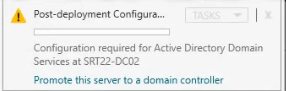 Server Manager dashboard on SRT22-DC02 showing the post-install yellow notification flag and the Promote this server to a domain controller link that launches the AD DS Configuration Wizard