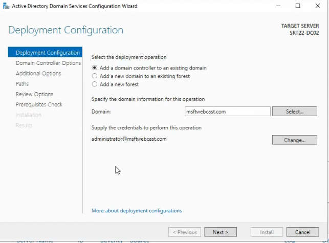 Active Directory Domain Services Configuration Wizard Deployment Configuration page with Add a domain controller to an existing domain selected and the credentials field populated with administrator@msfwebcast.com