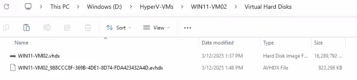 File Explorer at the VM Virtual Hard Disks folder showing only the parent .vhdx file present with the .avhdx differencing disk now merged and removed