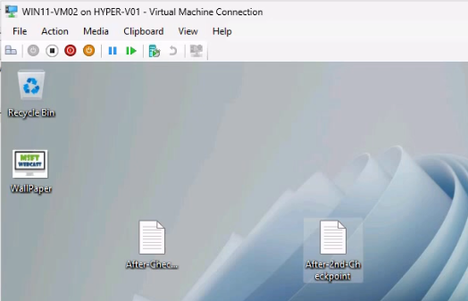 Win11-HF-VM02 desktop after the merge showing both AfterHyperCheckpoint1.txt and AfterSecondCheckpoint.txt files still present confirming no data loss during the merge