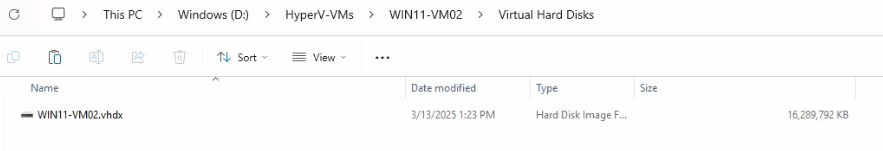 File Explorer at the same Virtual Hard Disks folder after the merge showing only the parent VHDX file present with both AVHDX differencing disks now removed