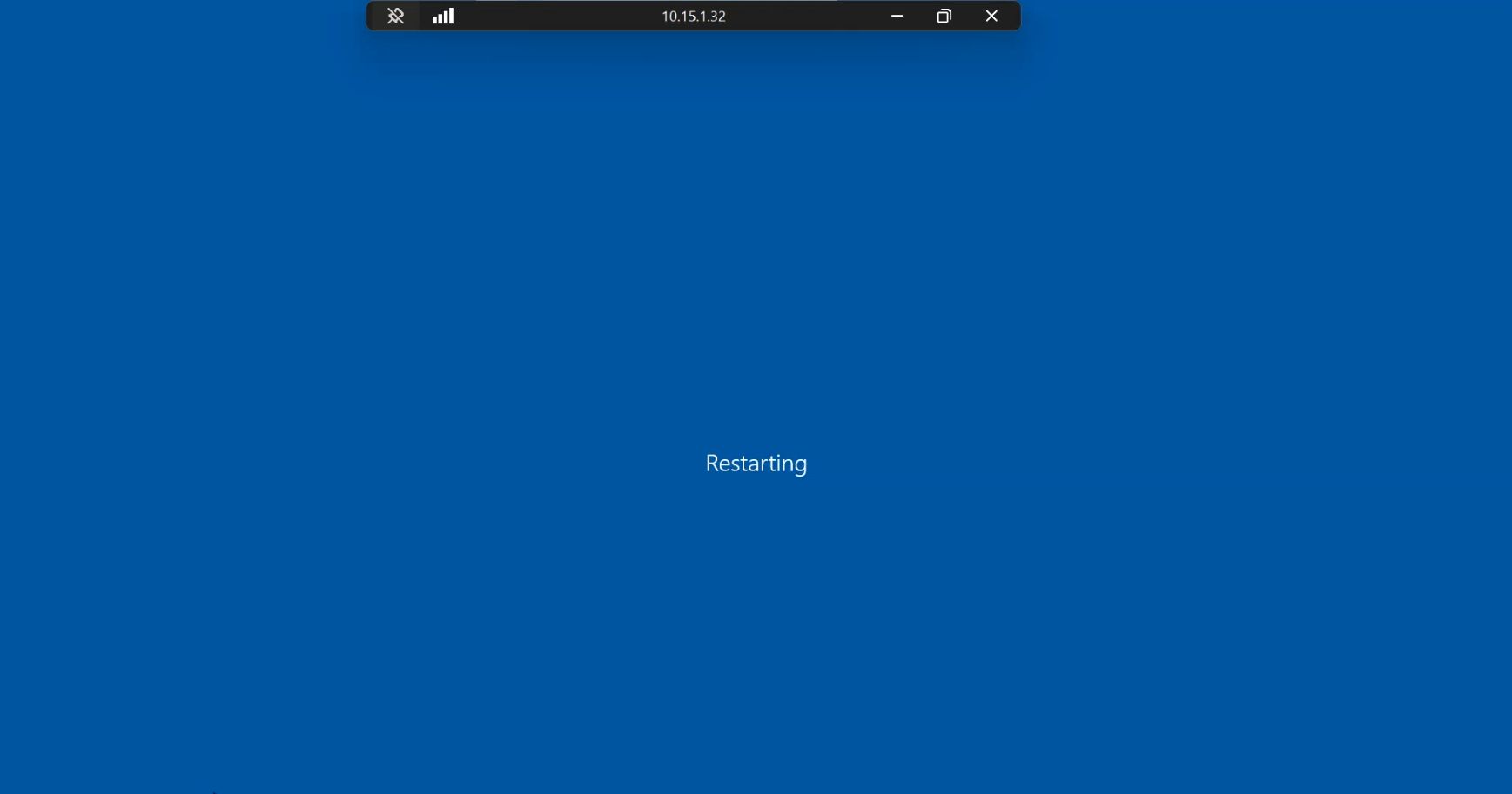 Windows shutdown screen on the controller console showing the restart in progress with the host name visible, the brief outage that lets the new password filter register with LSASS during boot