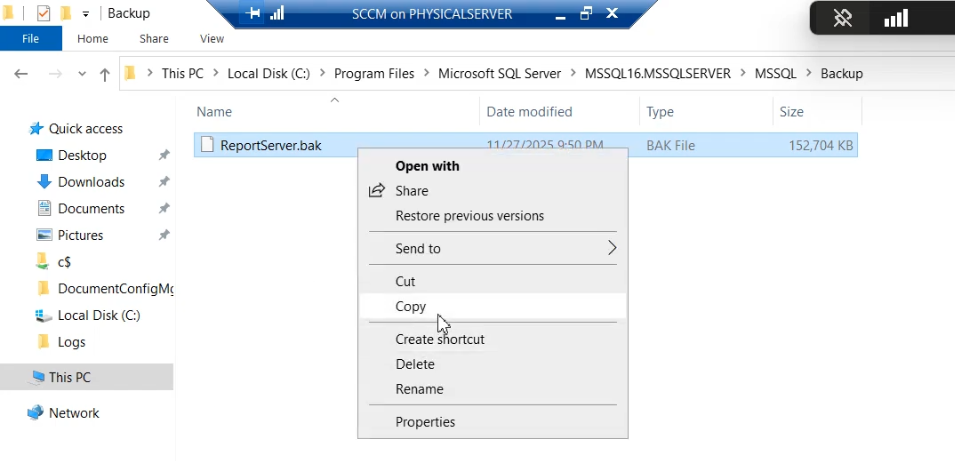 File Explorer copying the .bak file from the legacy server to the C:\\DbBackups share on Node-02, the transfer step before restore