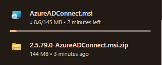 Windows File Explorer in the staging folder showing both installer files side by side: the latest version (top) and the N-1 version 2.5.79.0 (bottom), the visual confirmation that both files are present and named distinctly