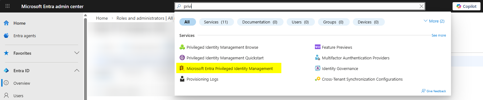 Entra admin center as Global Admin opening the Privileged Identity Management service from the search bar