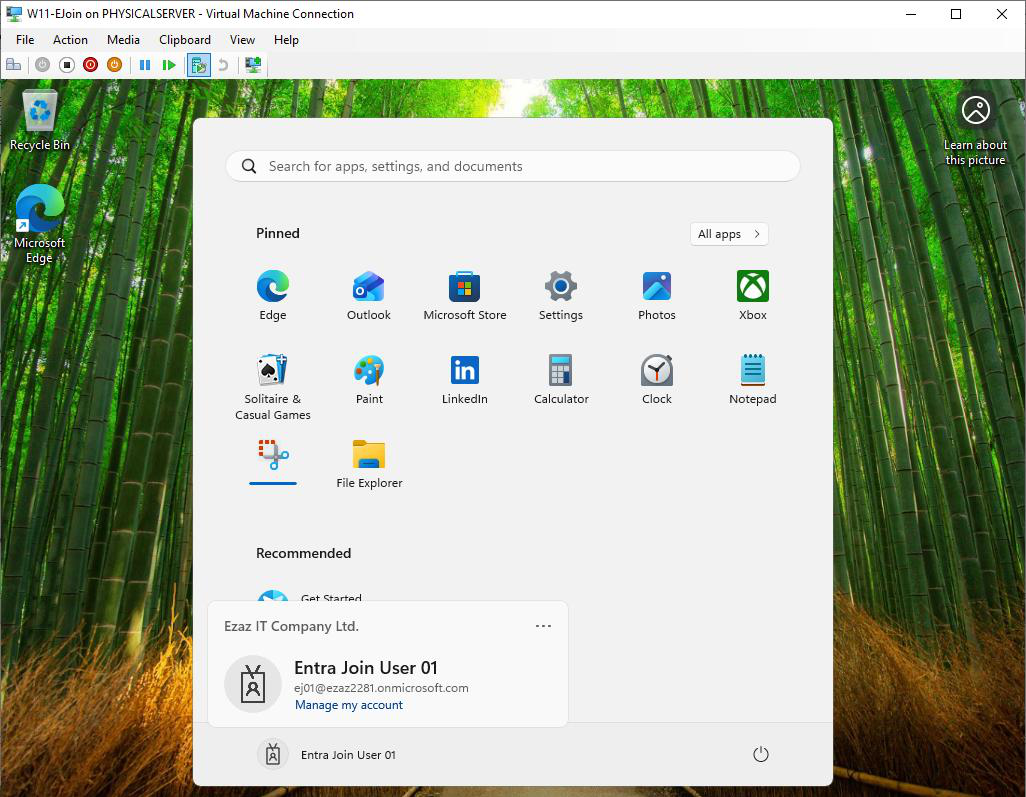 Windows desktop logged in with the Entra ID account showing the user is now signed in with their work credentials