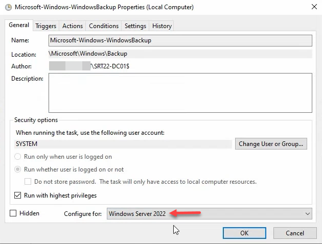 Task Properties General tab with SYSTEM account selected and Configure for set to Windows Server 2022