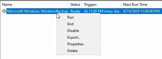 Windows Server Backup console showing scheduled backup task with status and disk usage information